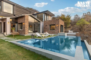 StayVista's Ikebana - Living By The Forest Edge - Mountain-view Villa with Infinity Pool, Lawn, & Indoor-Outdoor Games